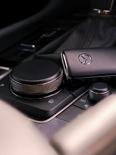 a close up of a cell phone on a car dashboard