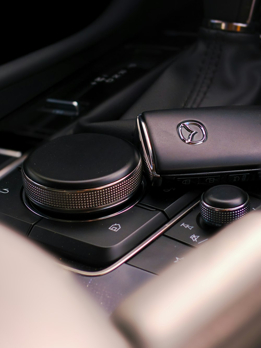 a close up of a cell phone on a car dashboard