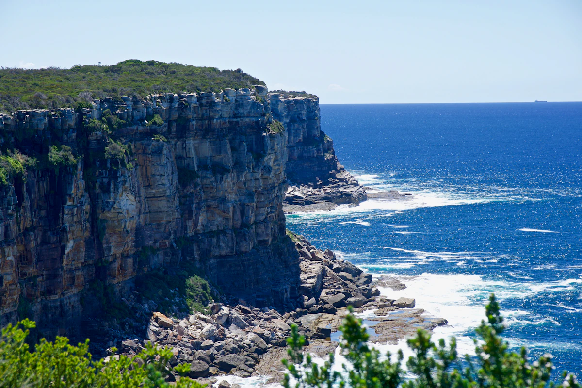 Sandstone cliffs and coastal scrub at North Head looking over the ocean