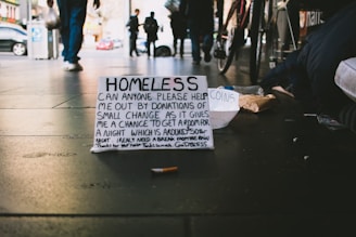 people walking on pathway and banner on ground