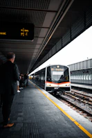 people standing on train station