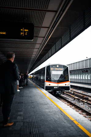 people standing on train station