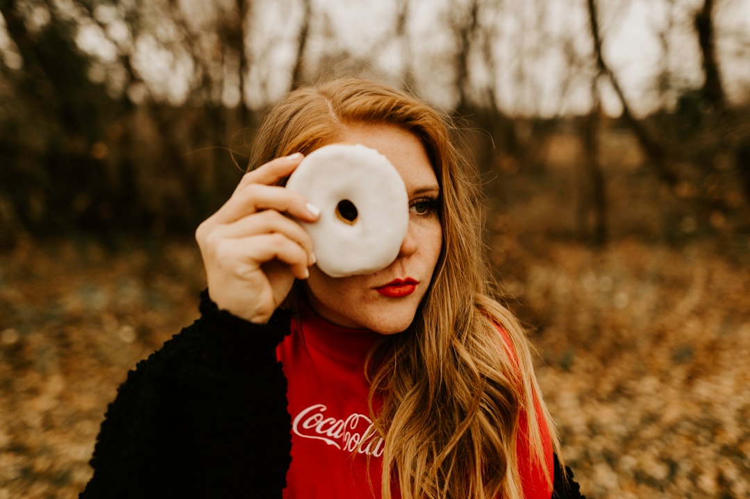 woman holding donut
