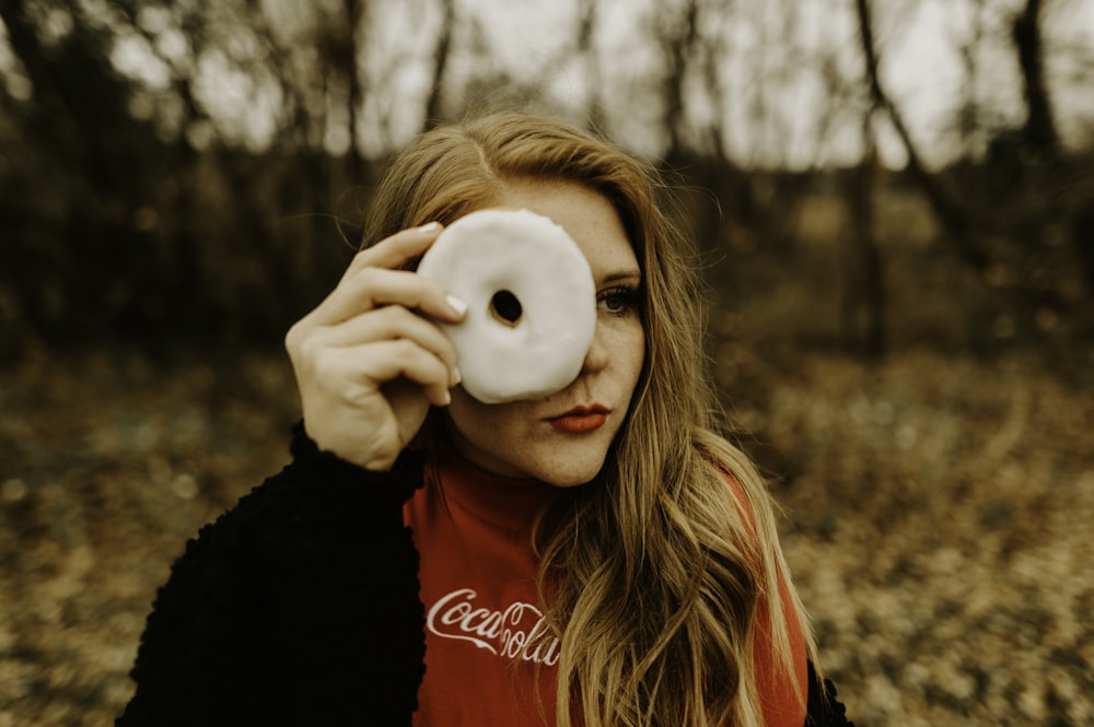 woman holding donut