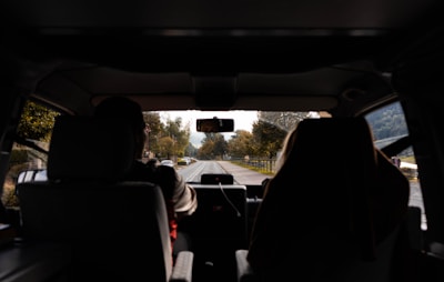 man driving car on roadway