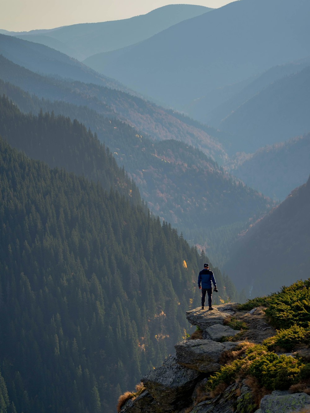 man standing near cliff edge