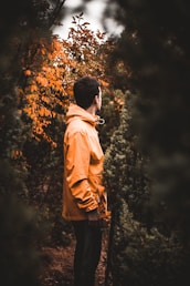 man in an orange hoodie jacket