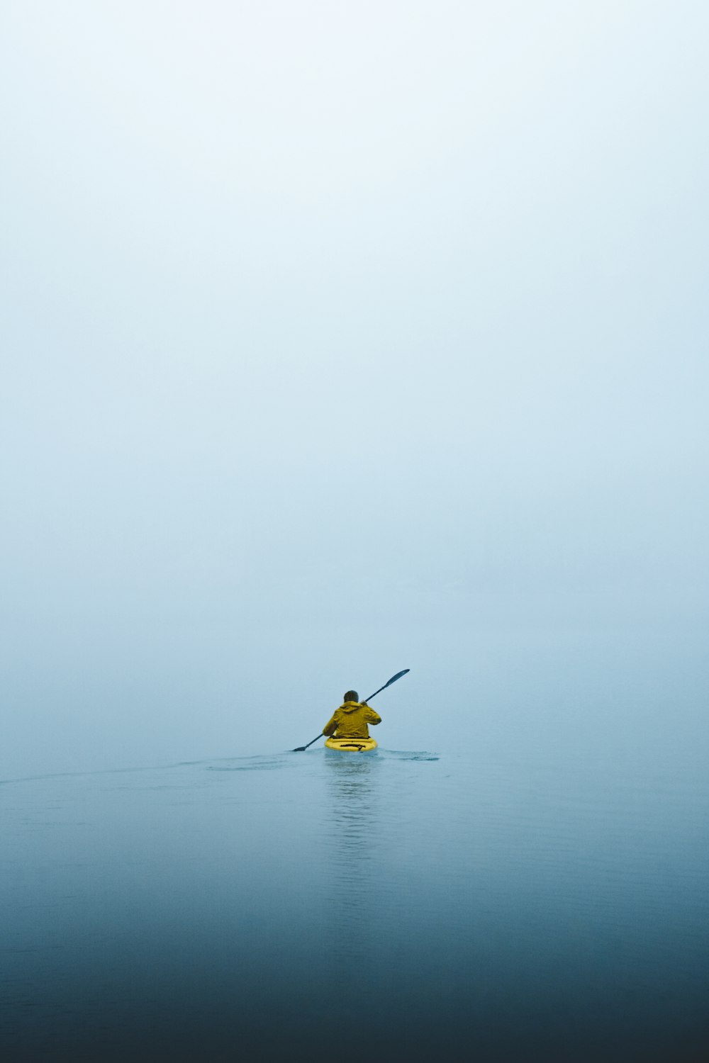 man on kayak during daytime