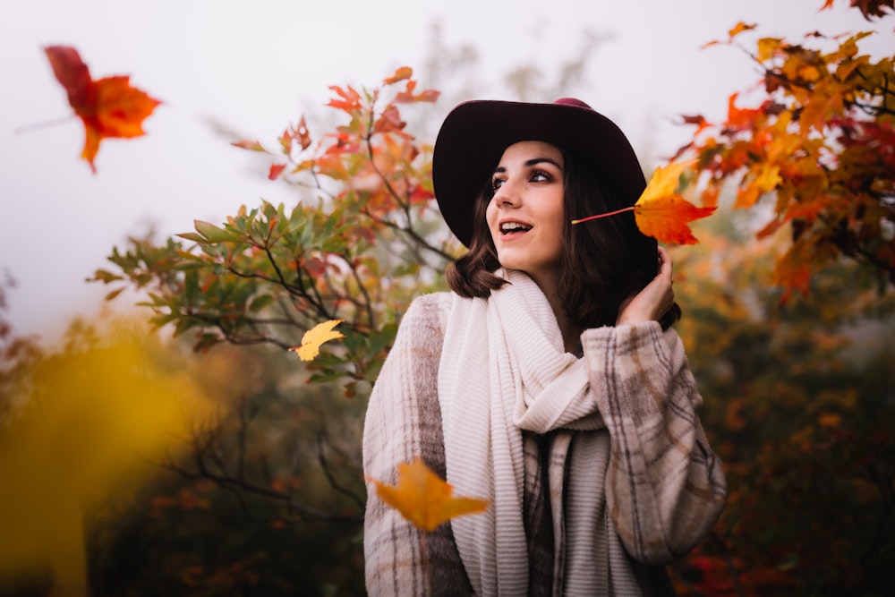 woman wearing black and beige plaid coat