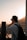 A traveler capturing memories with a beautiful sunset backdrop.