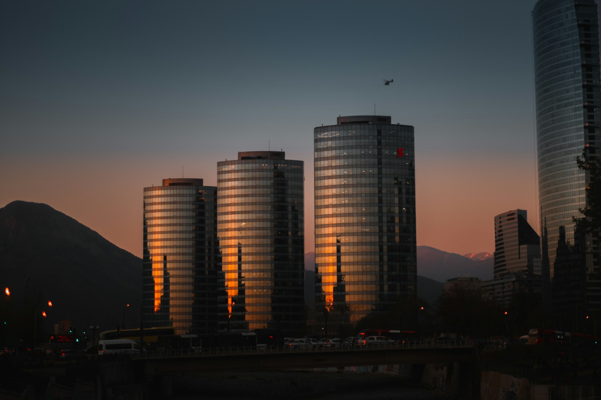 view photography of three curtain buildings during dawn