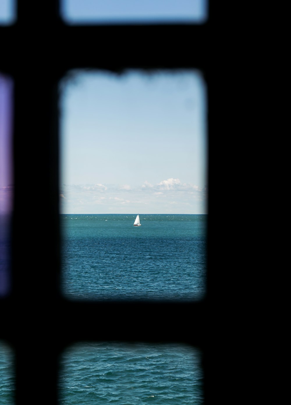 white sailboat on sea