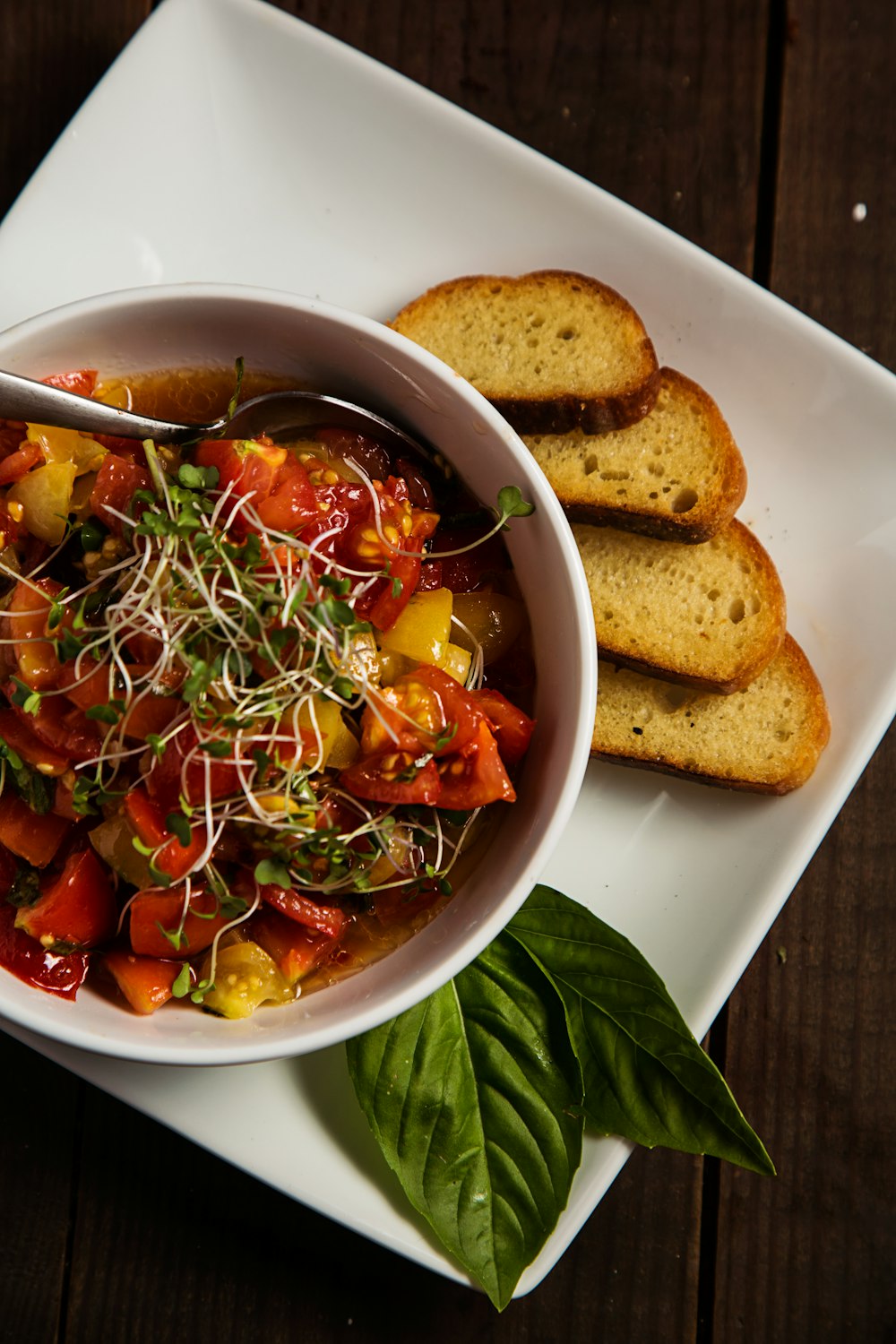 tomato dish and bread slices