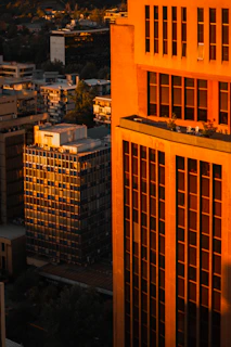 A high-resolution photo showcasing a minimalist urban landscape at sunset with soft golden light.