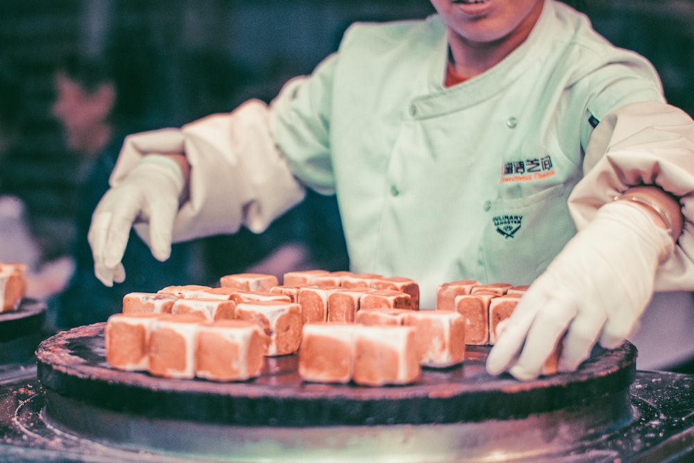 man cooking square hopia