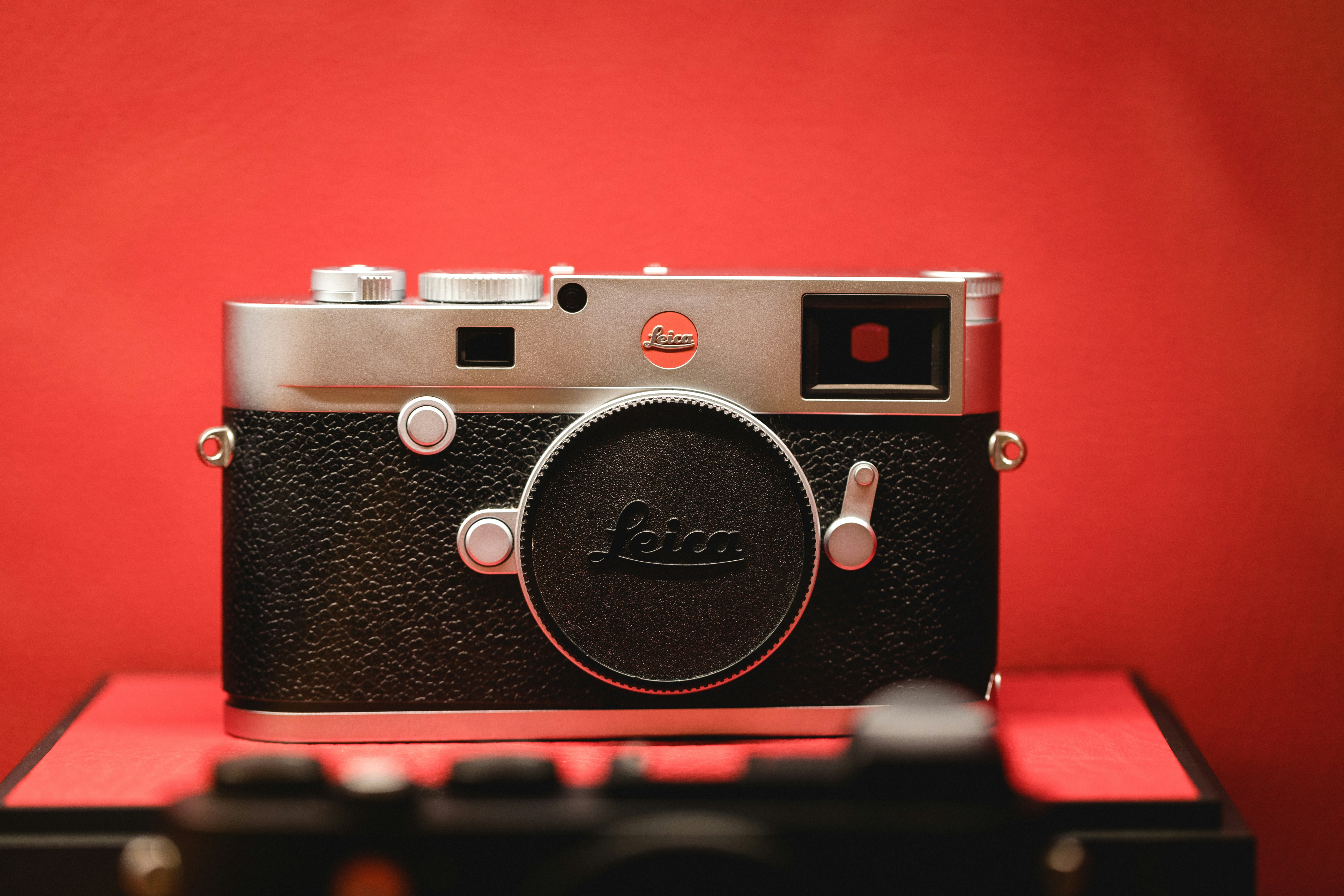 Leica on a red background