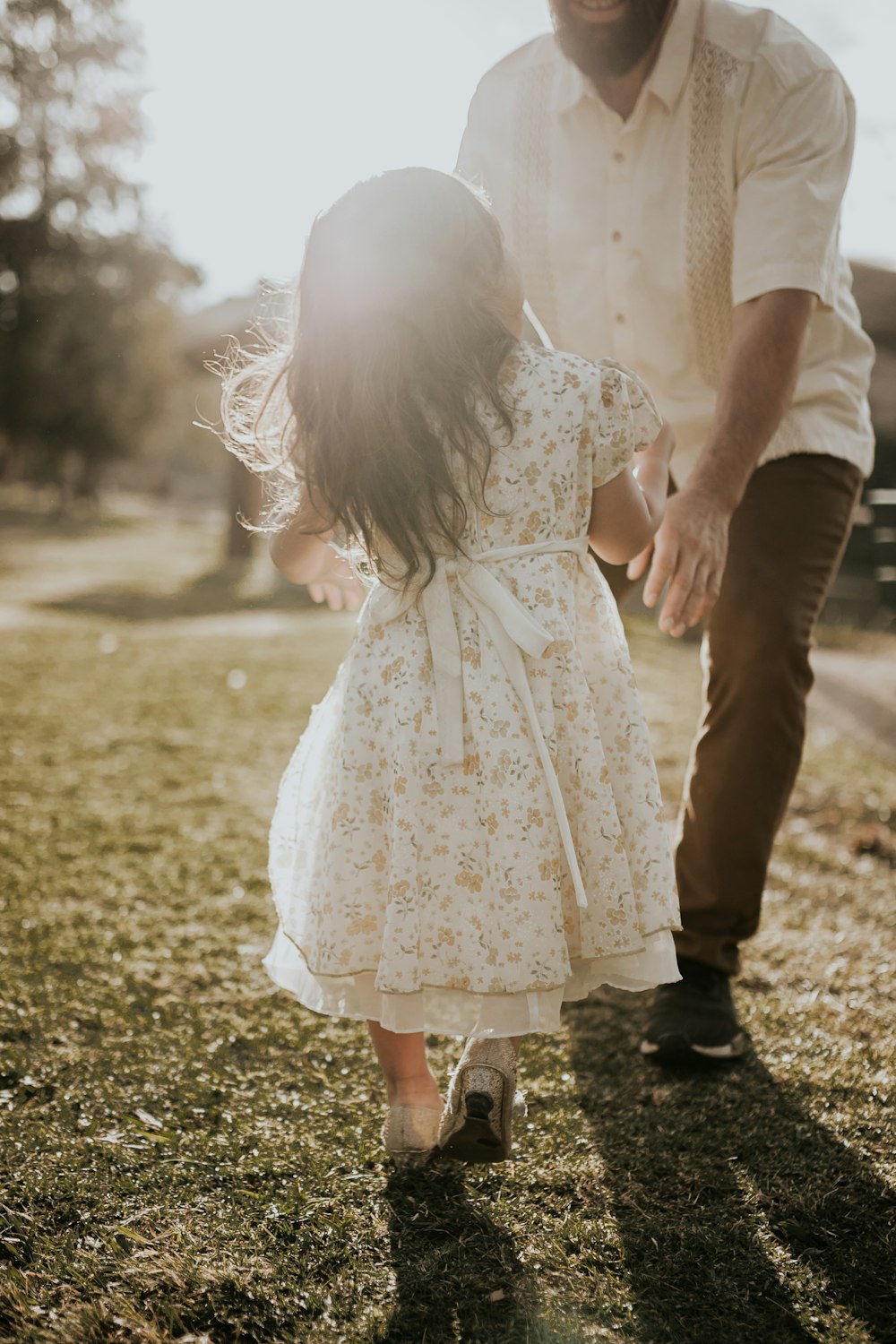 man standing in front of girl during daytime