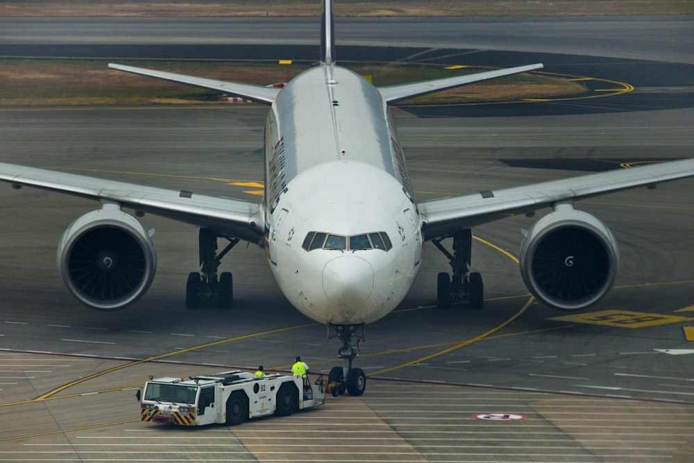 docked white and gray airplane