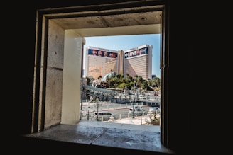 A vibrant street view from a Mumbai apartment window showing daily city life.