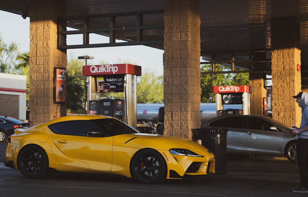yellow coupe beside QuikTrip stall