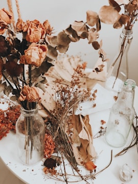 brown and green flowers on vase