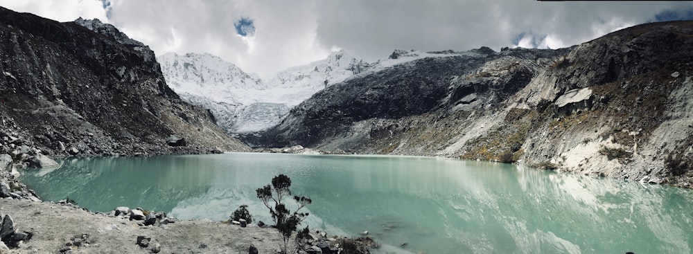 blue lake surrounded by mountains