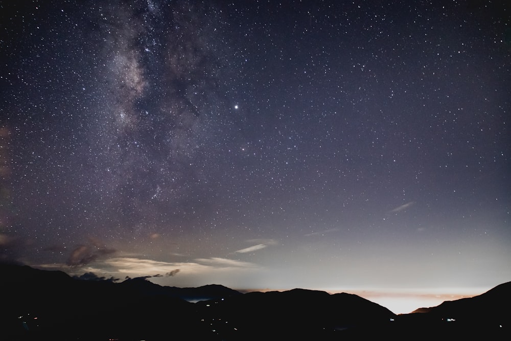 gray and black galaxy sky with stars