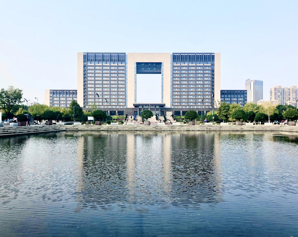 beige and blue concrete building near body of water