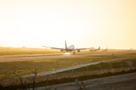 gray airplane at runway