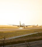 gray airplane at runway