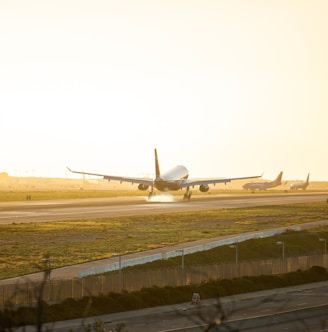 gray airplane at runway