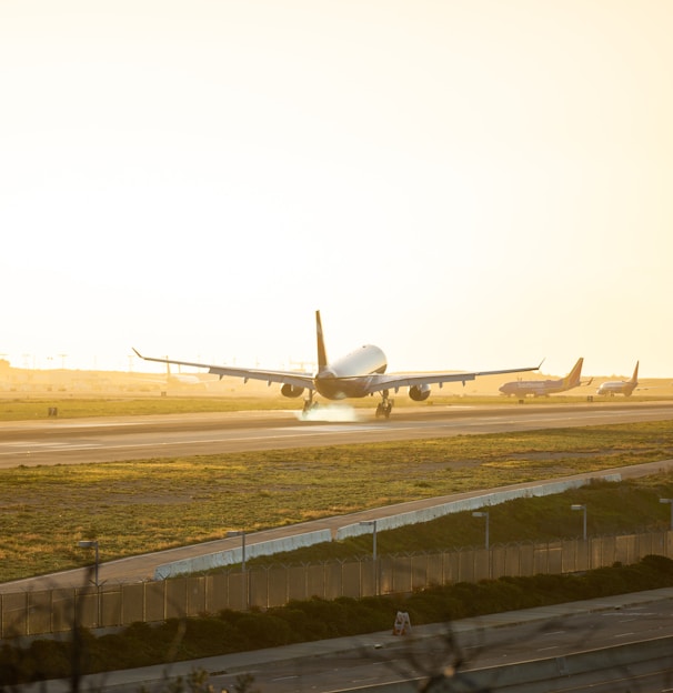 gray airplane at runway