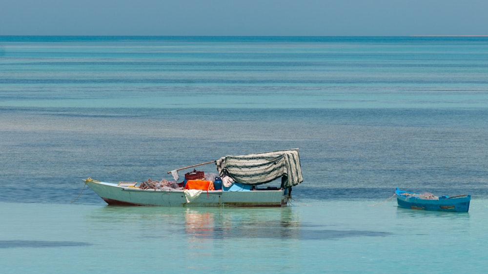 gray boat sailing during daytime