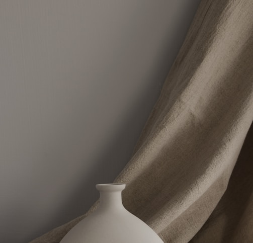 minimalist photography of two white ceramic vases
