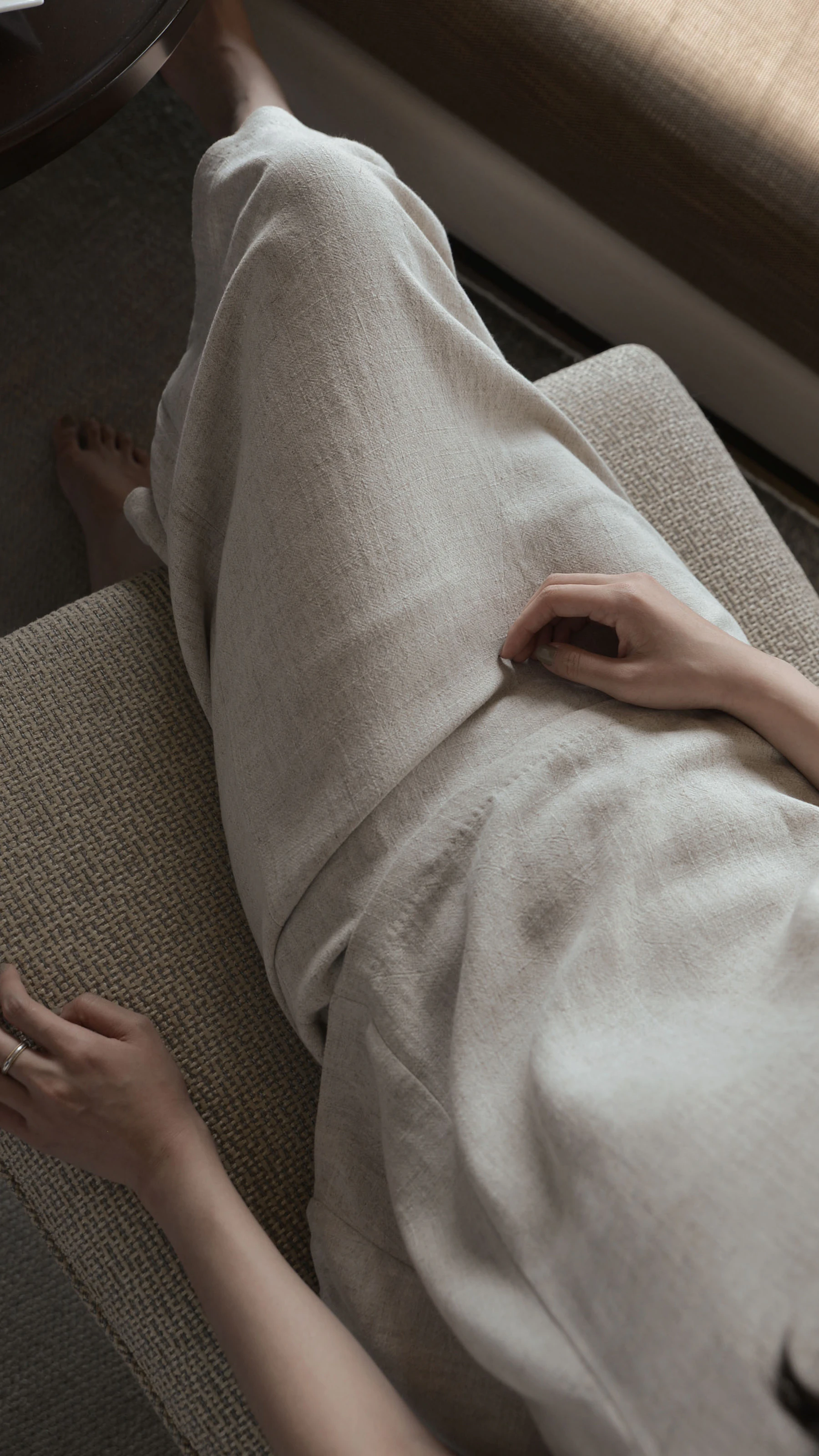 Woman in a relaxed white dress, editorial fashion styling