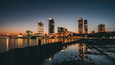 high-rise buildings near calm body of water