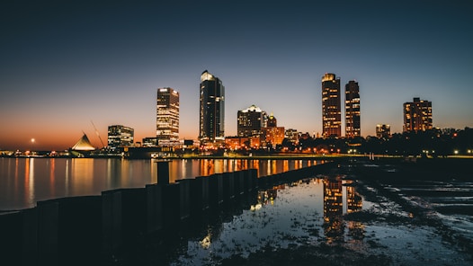 high-rise buildings near calm body of water