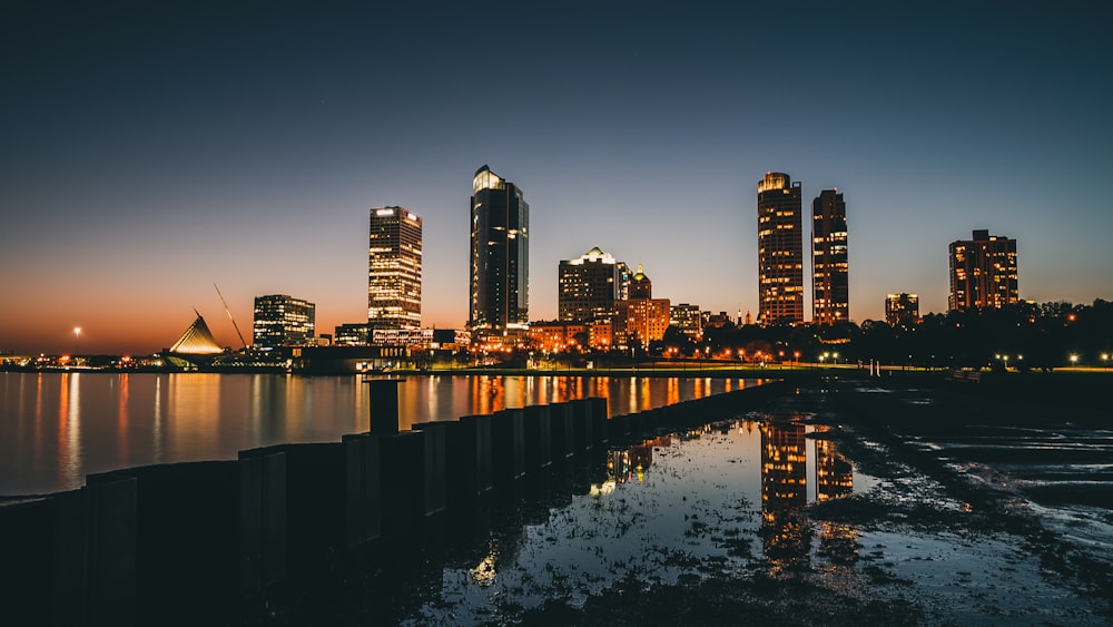 high-rise buildings near calm body of water