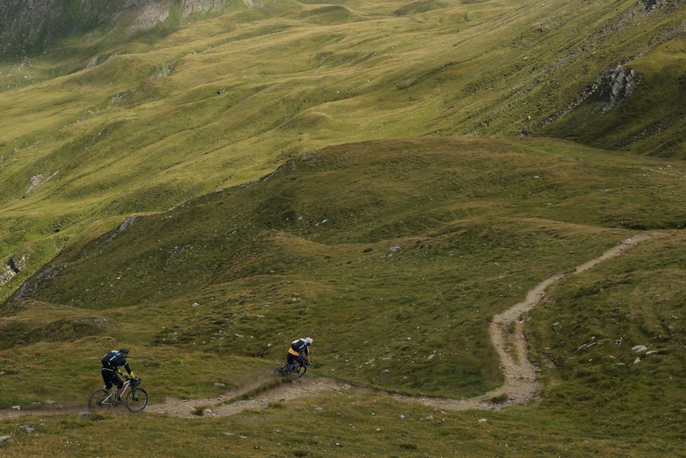 two mountain bikers practising mountain biking skills on a descent