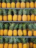 ripe pineapple fruits on shelf