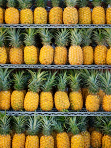 ripe pineapple fruits on shelf