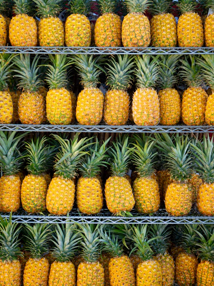 ripe pineapple fruits on shelf