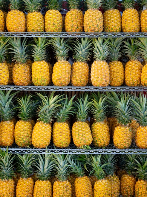 ripe pineapple fruits on shelf