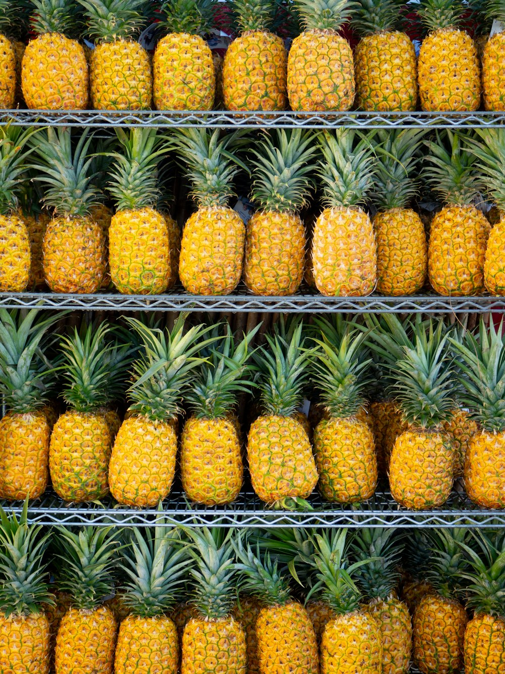ripe pineapple fruits on shelf