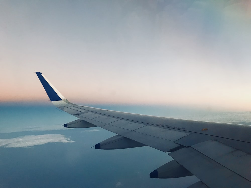 white and blue plane of airplane view