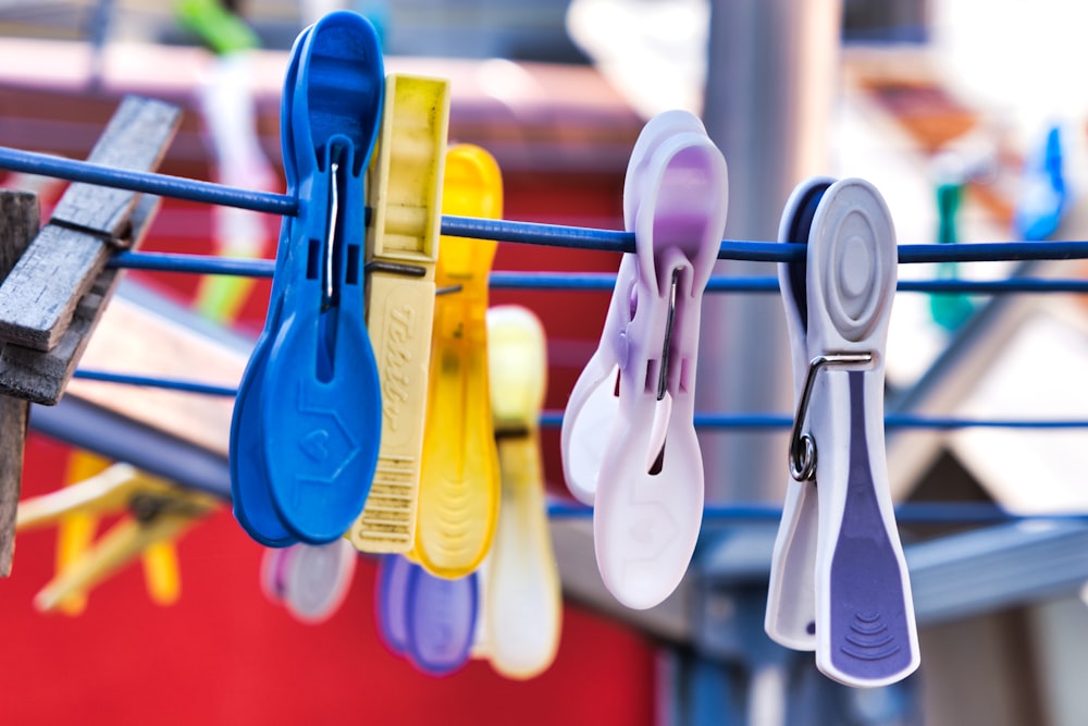 selective focus photography of assorted-color clothespins