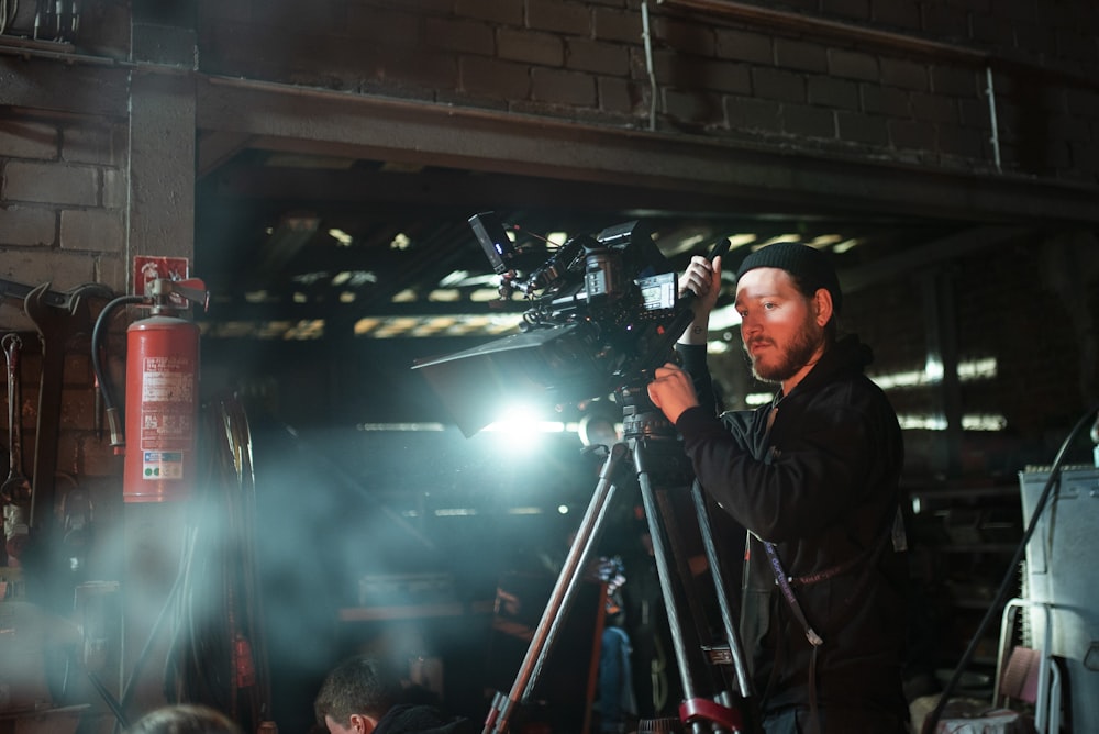 man holding black camera