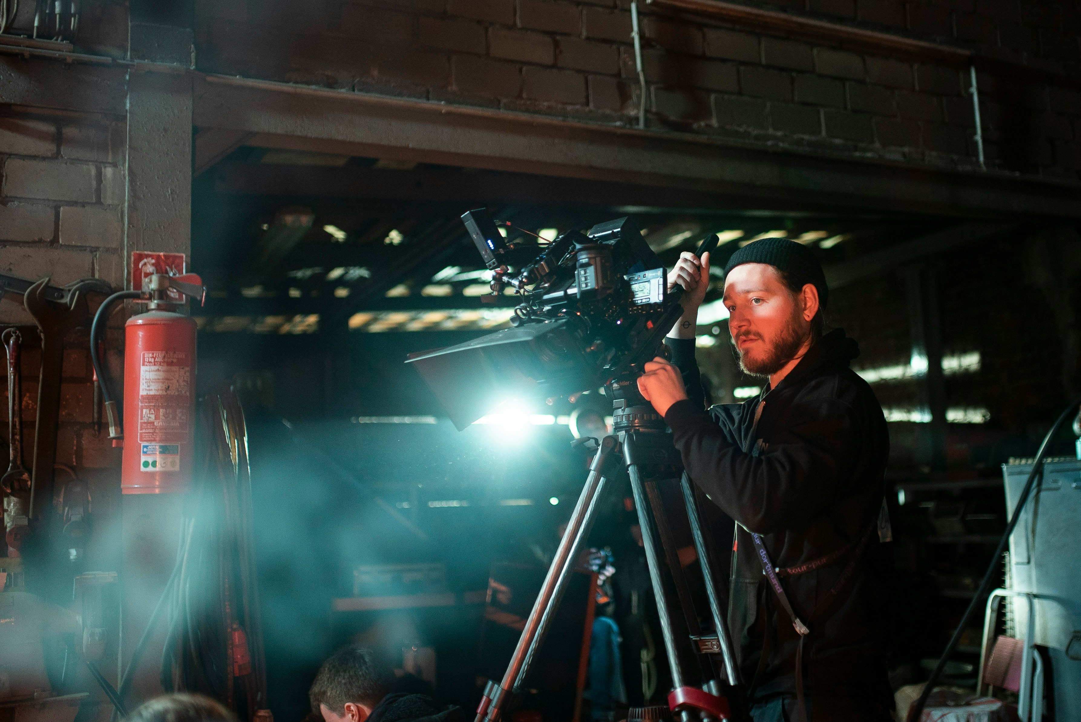 man holding black camera