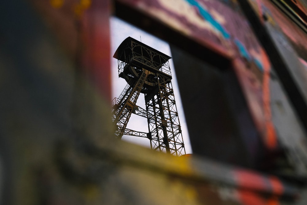 a view of a tower through a window