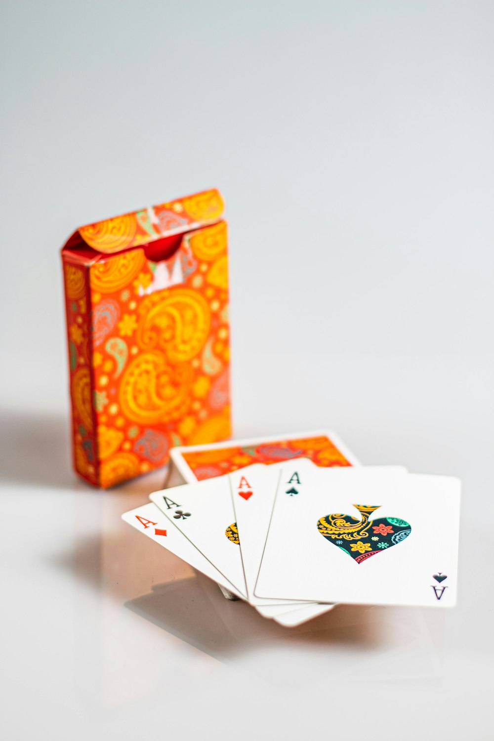 four ace playing cards with box